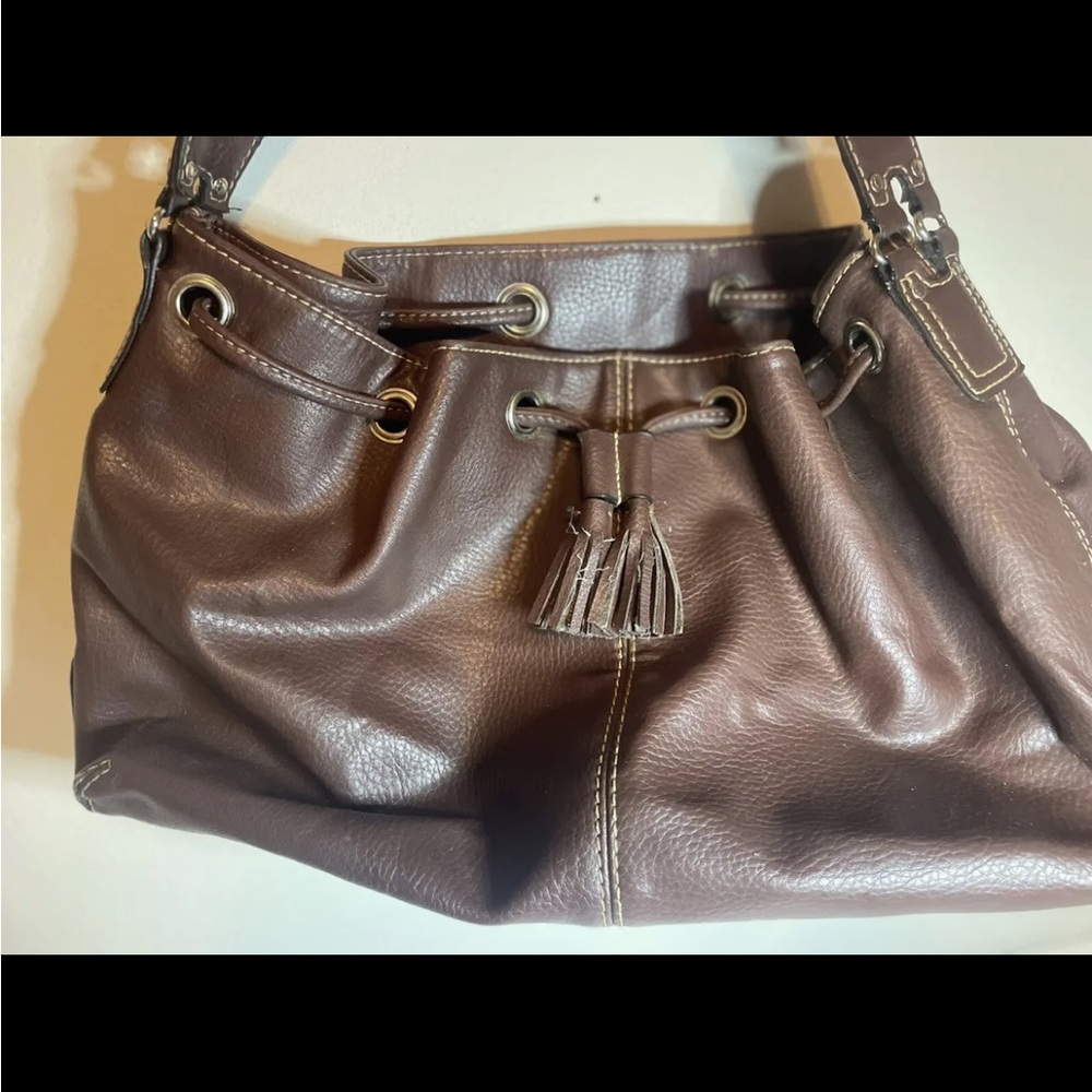 leather bag . Tommy hil, brown color.